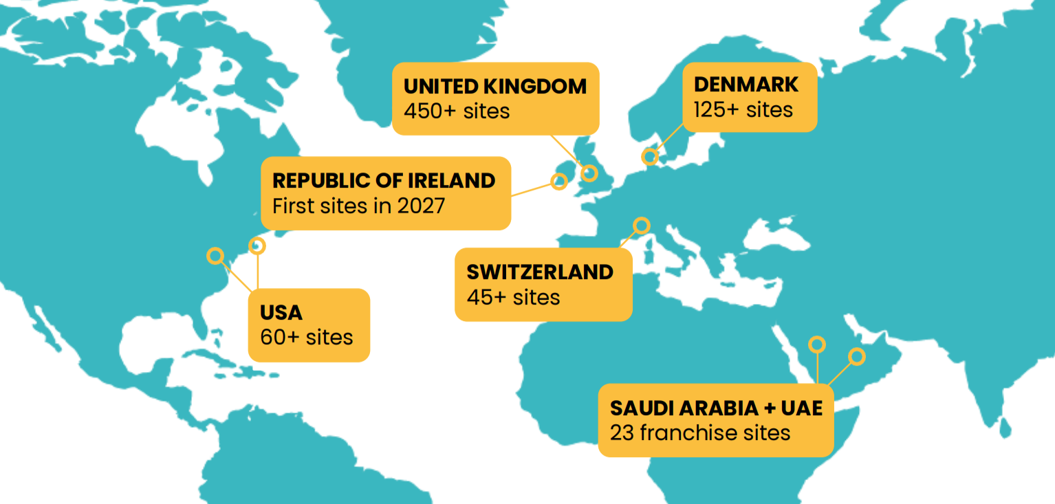 World map showing PureGym site counts in the UK, Denmark, Switzerland, USA, Saudi Arabia, UAE, and Ireland.